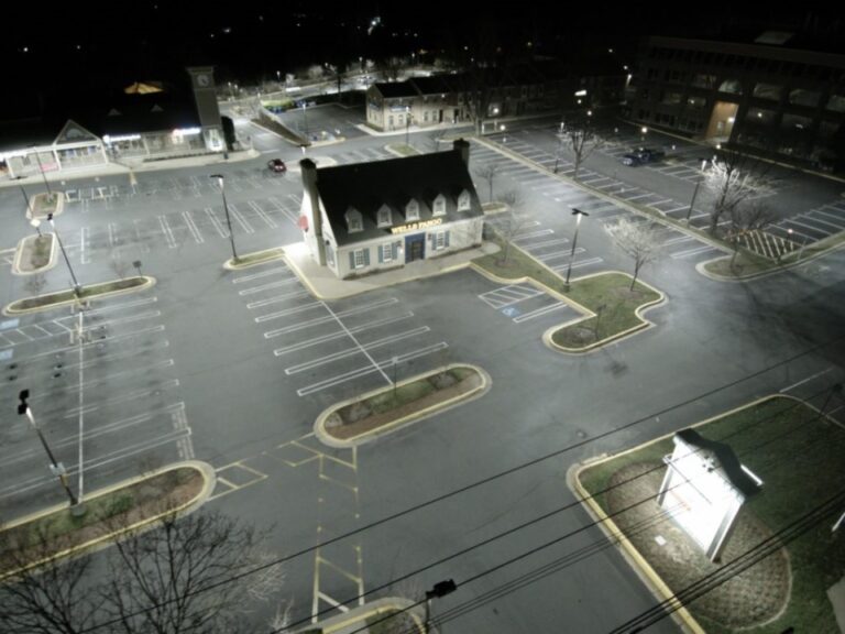 How does parking lot lighting provide safety?