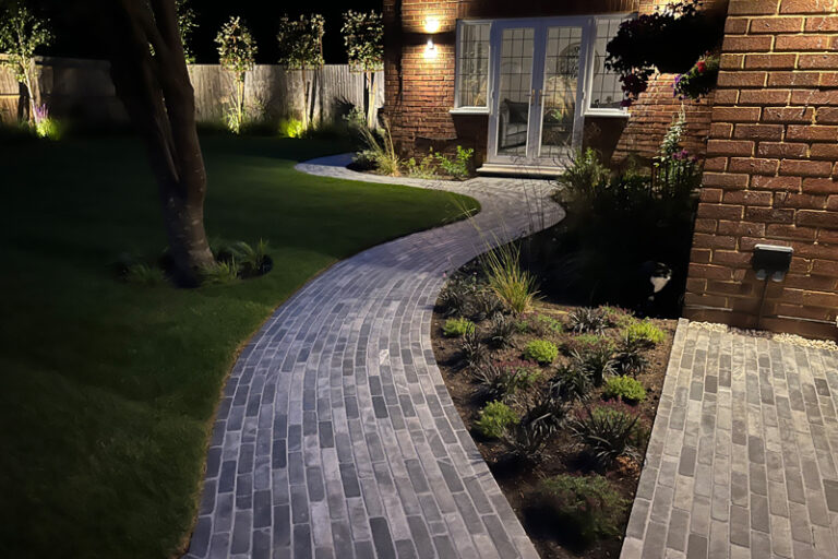 Why is low voltage lighting ideal for professional landscapes?